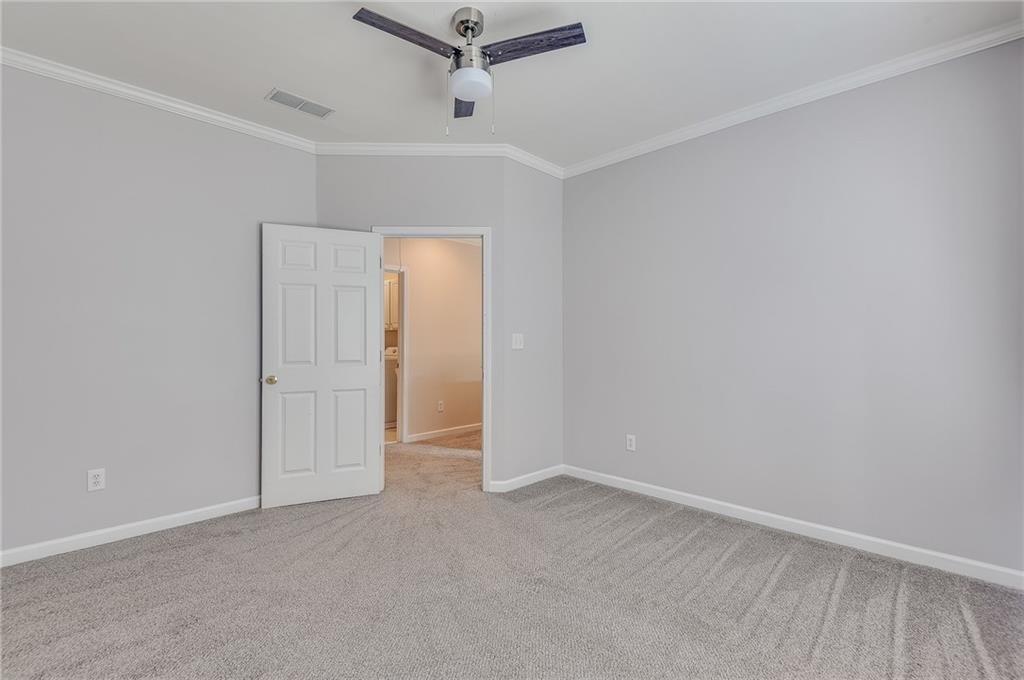 4115 Montvale Crossing Cumming, GA 30041 - Photo 36 of 38 an empty room with a empty space and windows