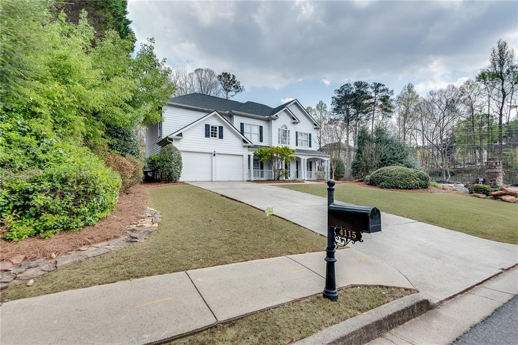 4115 Montvale Crossing Cumming, GA 30041 - Photo 38 of 38 a front view of a house with garden