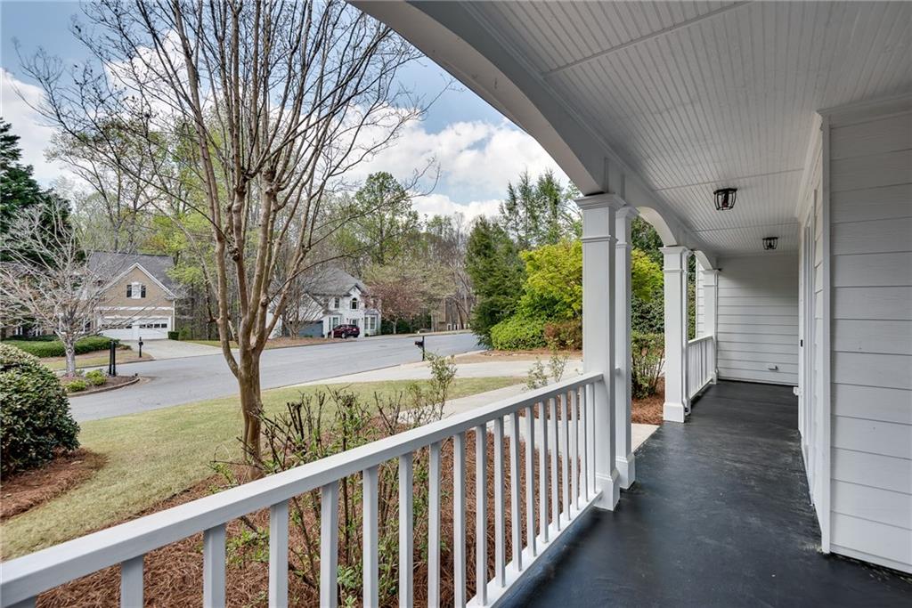 4115 Montvale Crossing Cumming, GA 30041 - Photo 4 of 38 a view of a porch with a yard