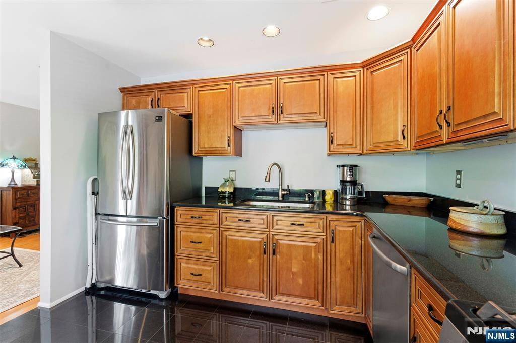 2063 Drake Court Mahwah, NJ 07430 - Photo 12 of 25 a kitchen with stainless steel appliances granite countertop a refrigerator and a stove top oven