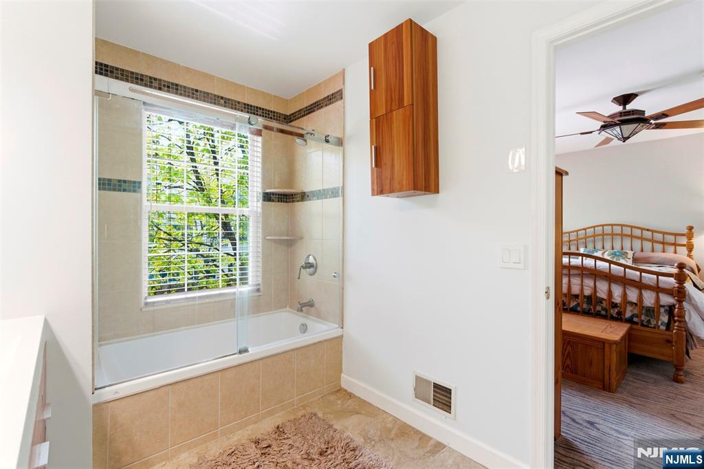 2063 Drake Court Mahwah, NJ 07430 - Photo 18 of 25 a bathroom with a bathtub and a shower