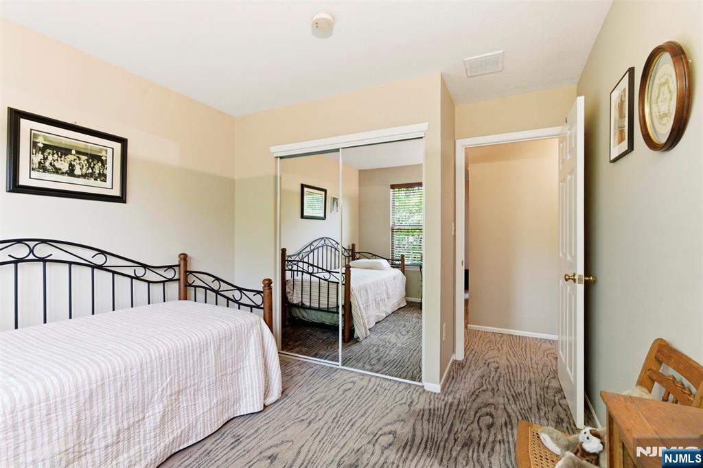 2063 Drake Court Mahwah, NJ 07430 - Photo 20 of 25 a bedroom with a bed a couch and dresser
