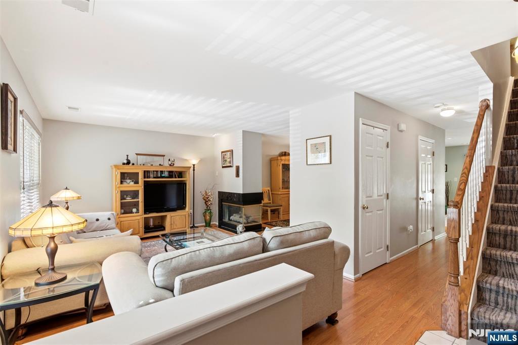 2063 Drake Court Mahwah, NJ 07430 - Photo 2 of 25 a living room with furniture and a flat screen tv