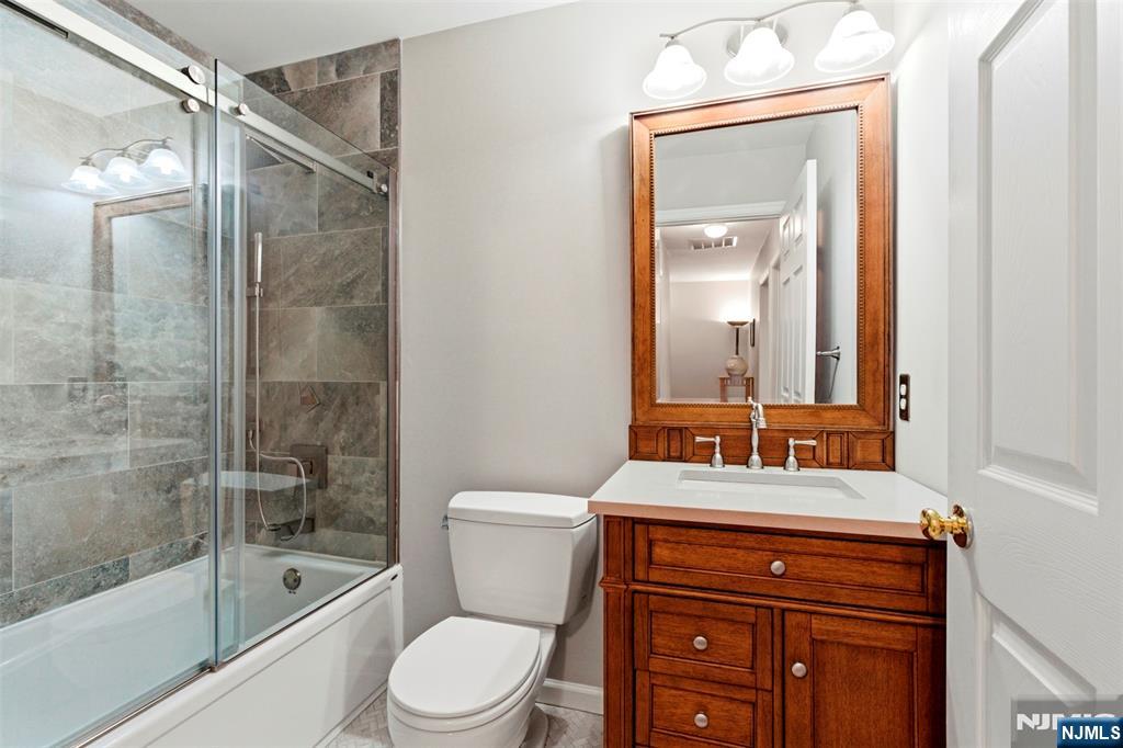 2063 Drake Court Mahwah, NJ 07430 - Photo 21 of 25 a bathroom with a sink a toilet and shower