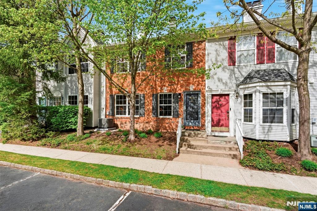 2063 Drake Court Mahwah, NJ 07430 - Photo 25 of 25 a front view of a house with garden and patio