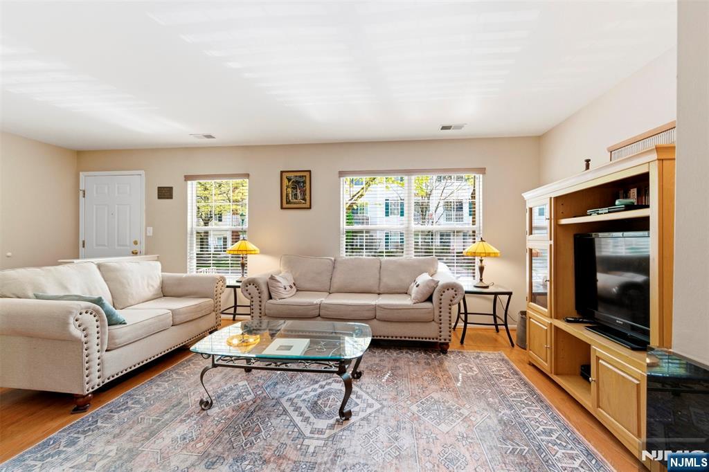2063 Drake Court Mahwah, NJ 07430 - Photo 3 of 25 a living room with furniture flat screen tv and a fireplace