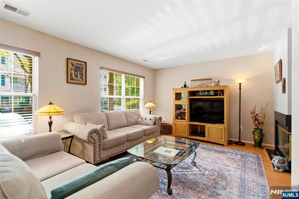 2063 Drake Court Mahwah, NJ 07430 - Photo 7 of 25 a living room with furniture and a flat screen tv