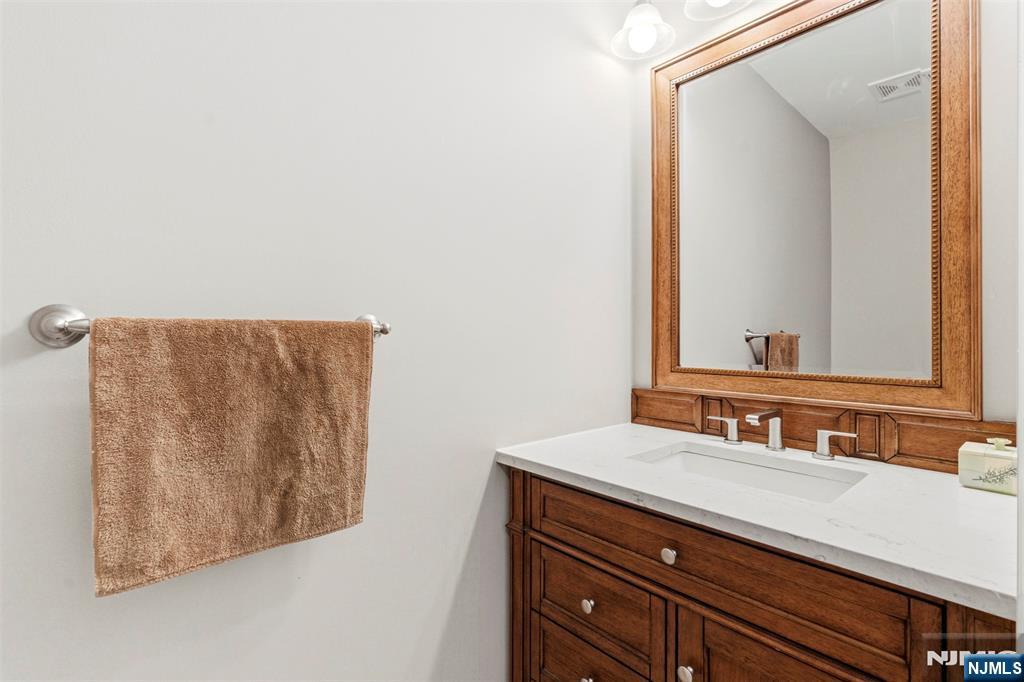 2063 Drake Court Mahwah, NJ 07430 - Photo 8 of 25 a bathroom with a sink and a mirror