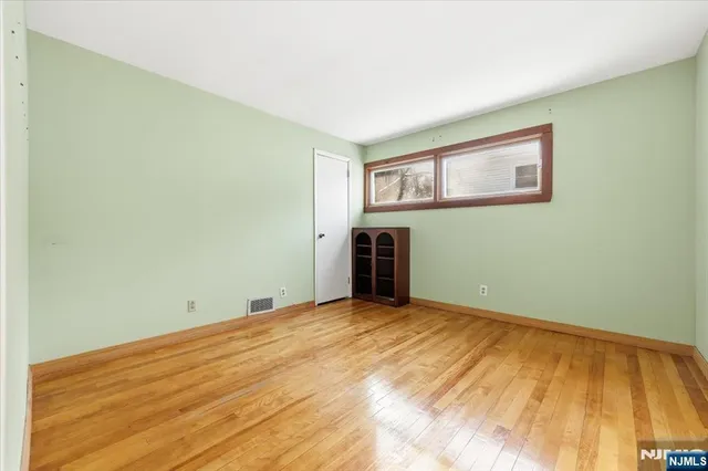 a bathroom with a toilet and a shower curtain
