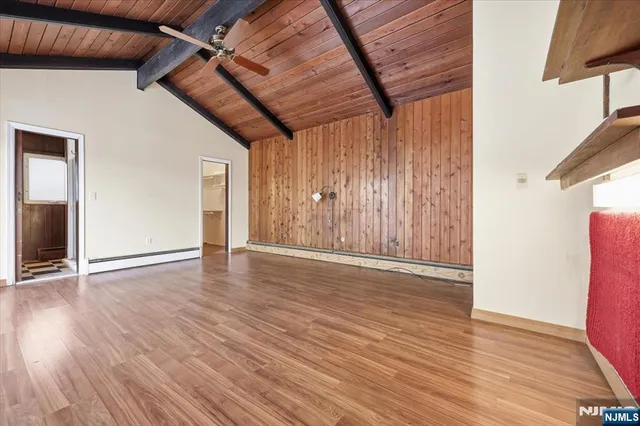 a view of a house with a yard and a patio