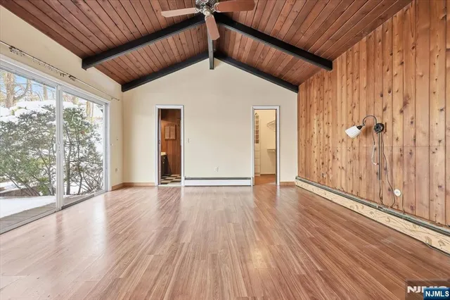 a view of a patio with a table and chairs and potted plants