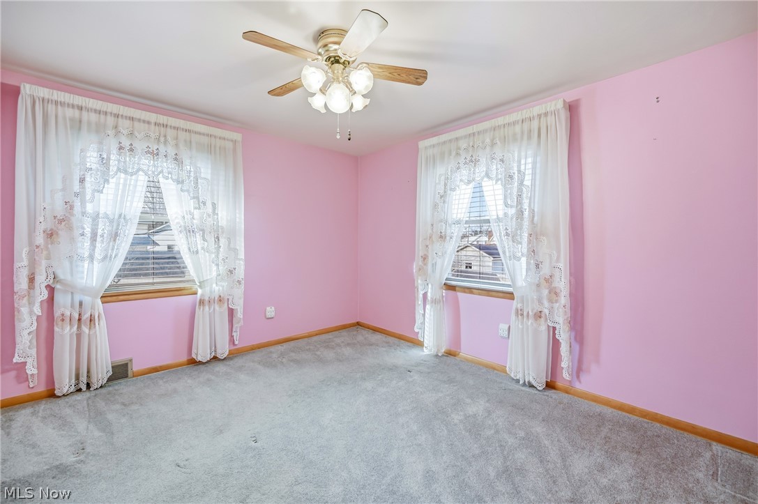 267 Butler Road Northeast Warren, OH 44483 - Photo 36 of 50 Carpeted spare room with ceiling fan and baseboards