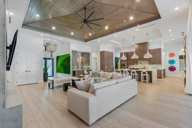 a bathroom with a granite countertop sink toilet a mirror and shower