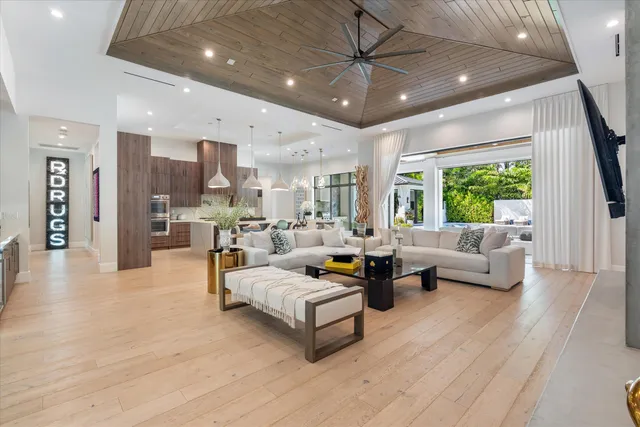 a bedroom with a bed and a flat tv screen next to a window