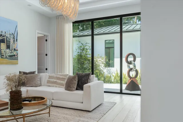 a view of a patio with couches and a potted plant