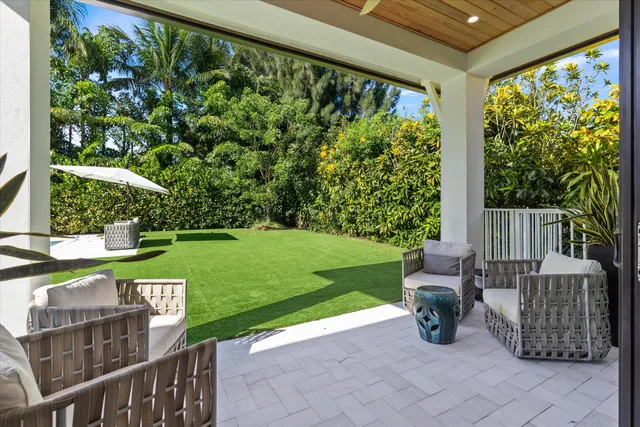 a view of a chairs in a backyard