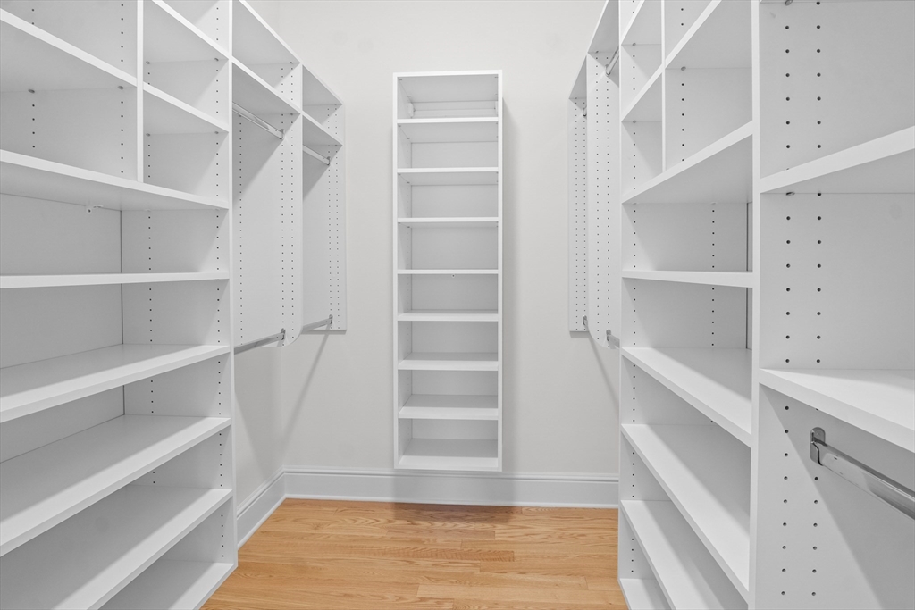 10 Deer Path Lane, Unit 10 Reading, MA 01867 - Photo 13 of 23 a view of walk in closet with empty racks