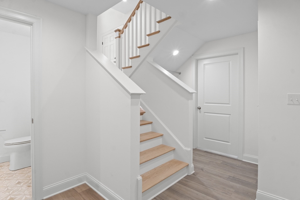 10 Deer Path Lane, Unit 10 Reading, MA 01867 - Photo 15 of 23 a view of entryway and hall with wooden floor