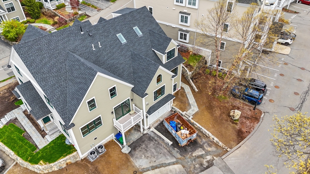 10 Deer Path Lane, Unit 10 Reading, MA 01867 - Photo 2 of 23 front view of a house with a street