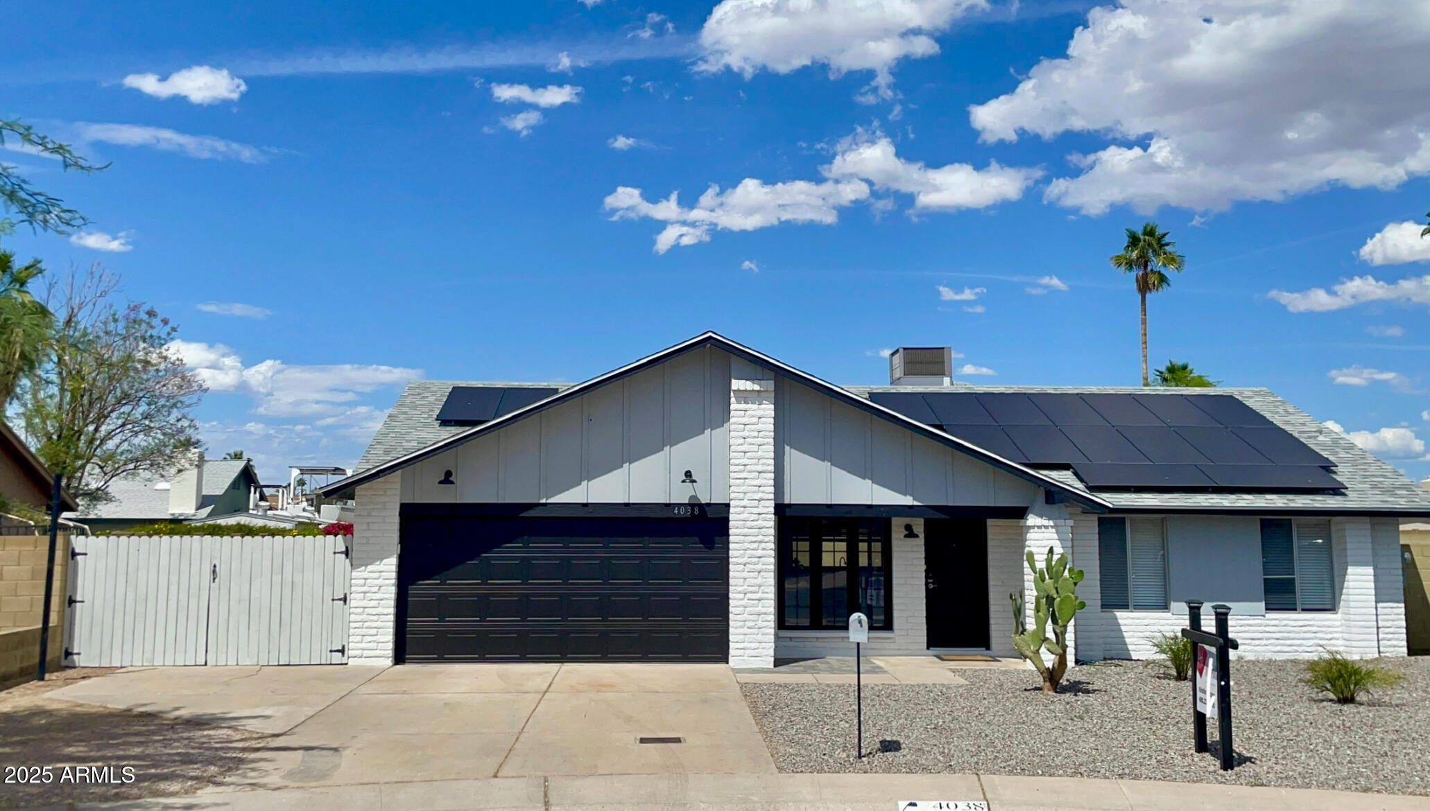 a front view of a house with a garage