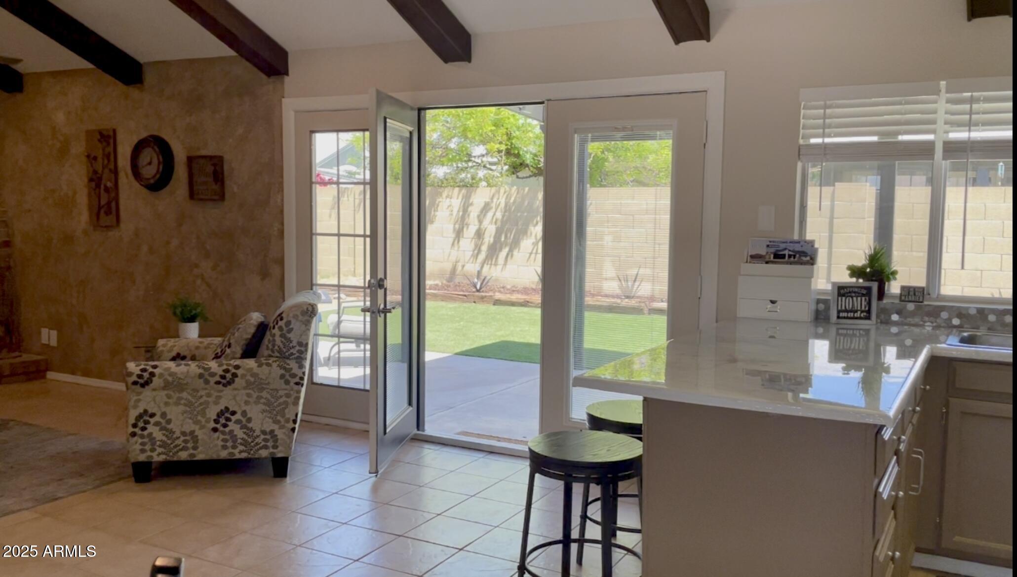 4038 West Windrose Drive Phoenix, AZ 85029 - Photo 14 of 43 a living room with furniture and large windows