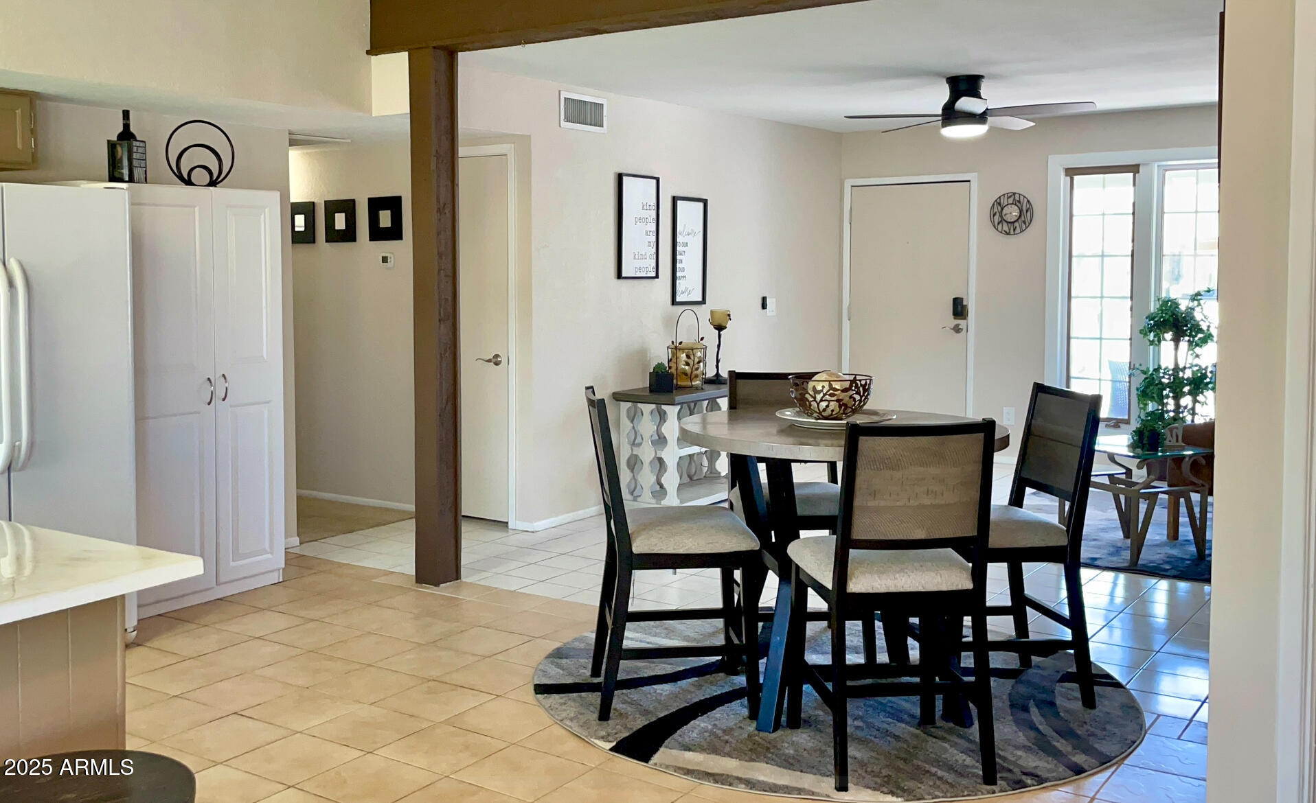 4038 West Windrose Drive Phoenix, AZ 85029 - Photo 17 of 43 a view of a dining room with furniture and window