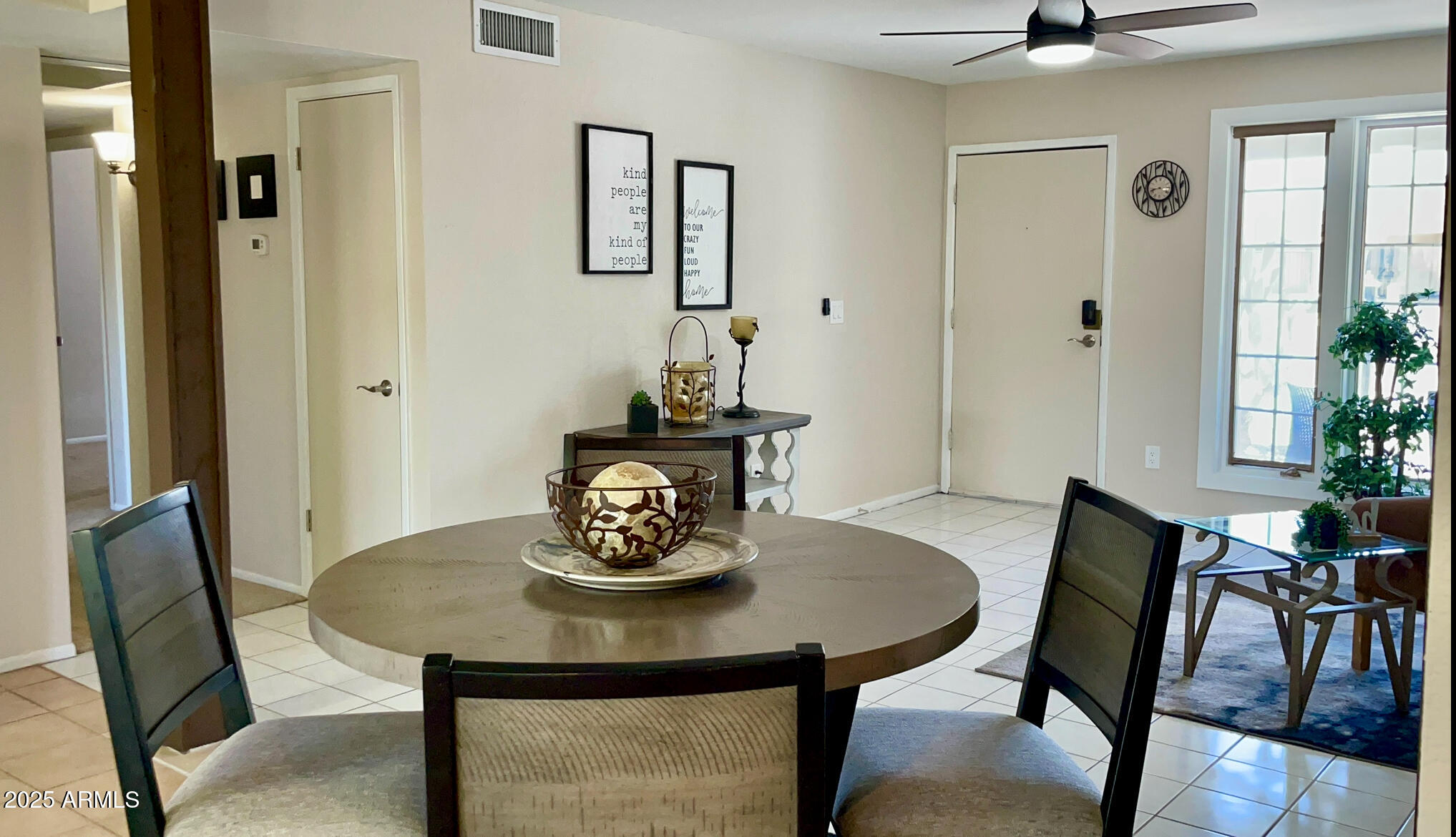 4038 West Windrose Drive Phoenix, AZ 85029 - Photo 18 of 43 a view of a dining room with furniture and wooden floor