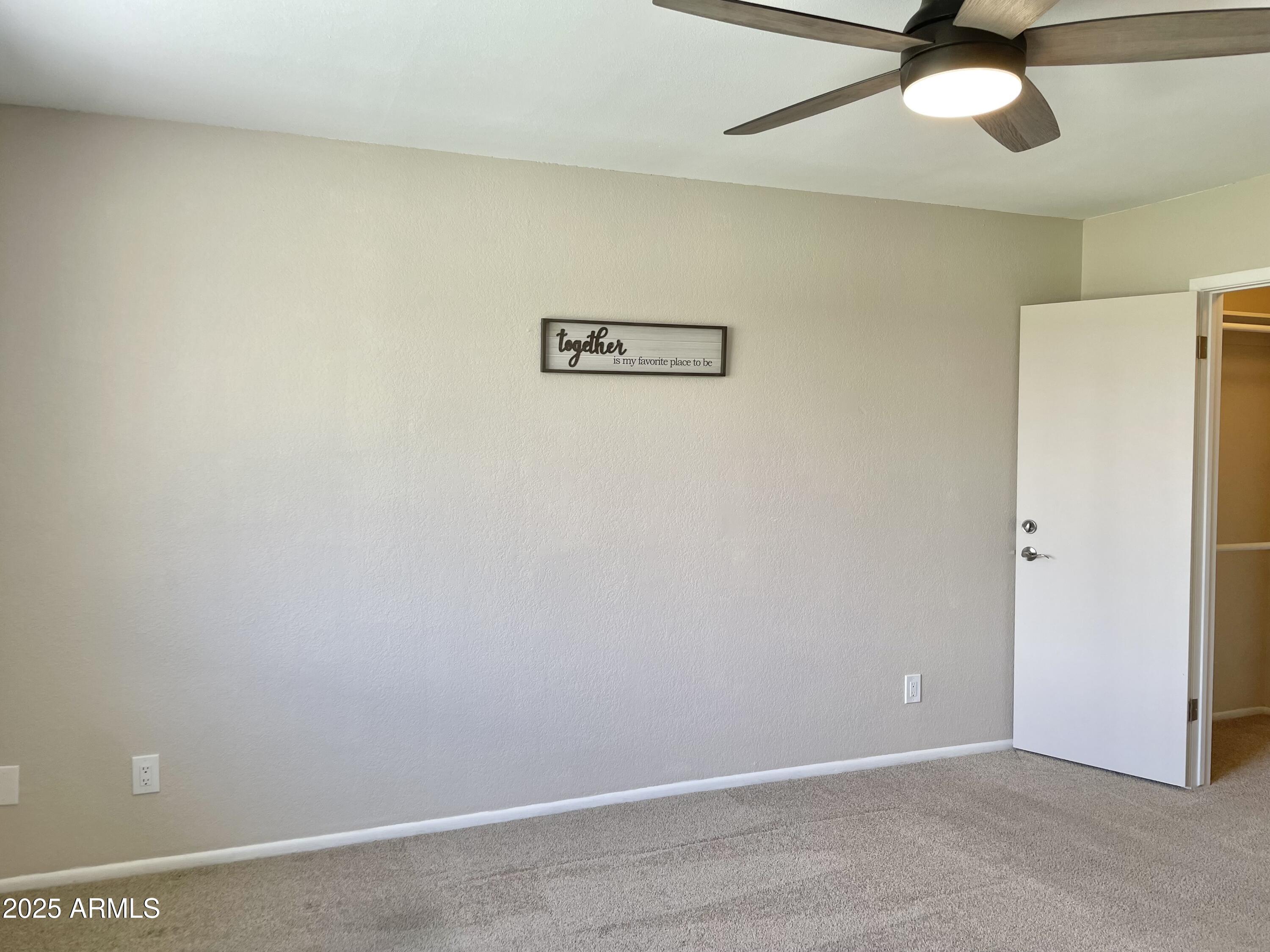 4038 West Windrose Drive Phoenix, AZ 85029 - Photo 29 of 43 a view of a hallway with a refrigerator