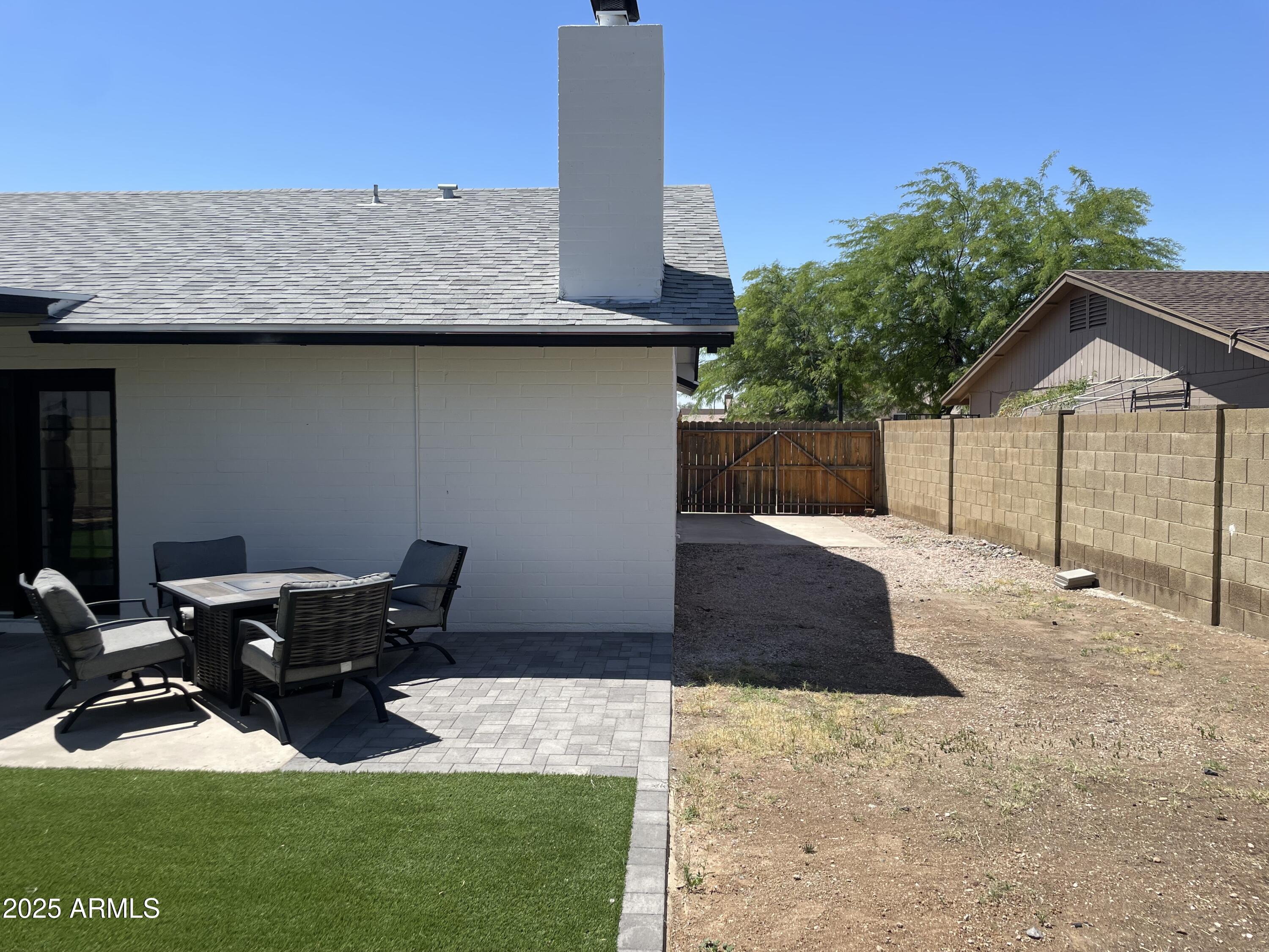 4038 West Windrose Drive Phoenix, AZ 85029 - Photo 43 of 43 a backyard of a house with table and chairs