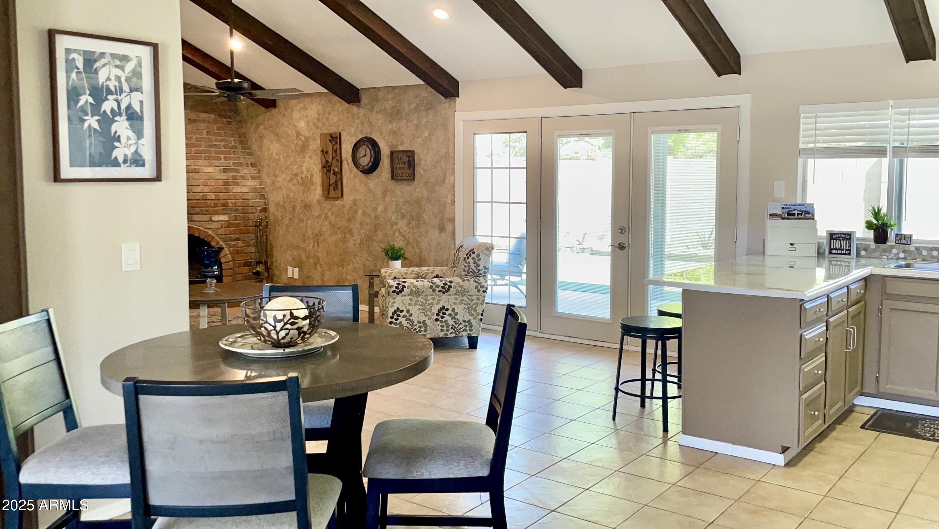 4038 West Windrose Drive Phoenix, AZ 85029 - Photo 6 of 43 a view of a dining room with furniture and window