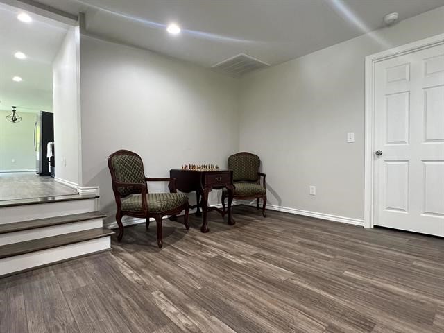10516 Peck Road Lumberton, TX 77657 - Photo 11 of 27 a view of a workspace with furniture and wooden floor