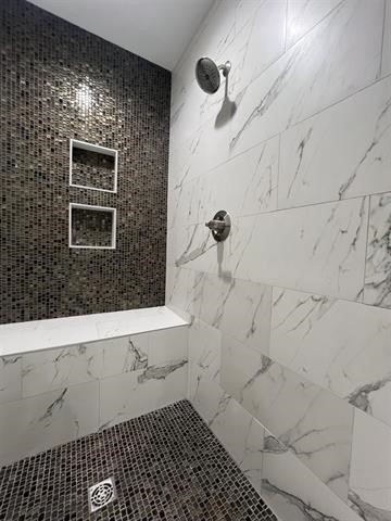 10516 Peck Road Lumberton, TX 77657 - Photo 16 of 27 a bathroom with a shower and a sink