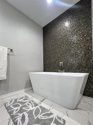 10516 Peck Road Lumberton, TX 77657 - Photo 18 of 27 a white tub sitting in a bathroom