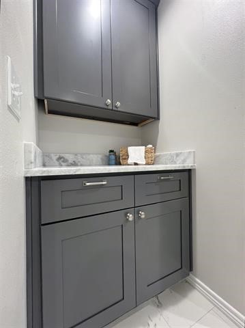 10516 Peck Road Lumberton, TX 77657 - Photo 19 of 27 a kitchen with a sink and cabinets