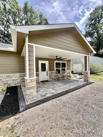 10516 Peck Road Lumberton, TX 77657 - Photo 2 of 27 a view of a house with a patio