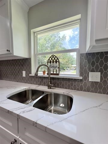 10516 Peck Road Lumberton, TX 77657 - Photo 8 of 27 a kitchen with a sink and a large window