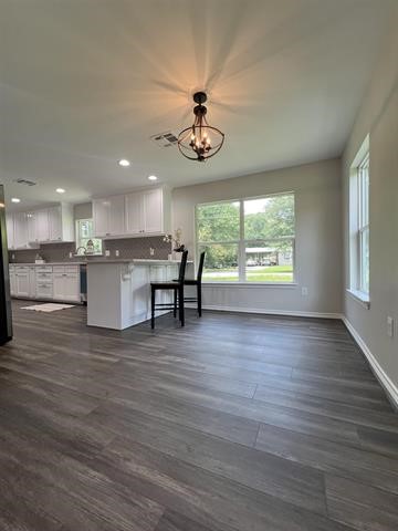 10516 Peck Road Lumberton, TX 77657 - Photo 10 of 27 an open kitchen with a table and chairs