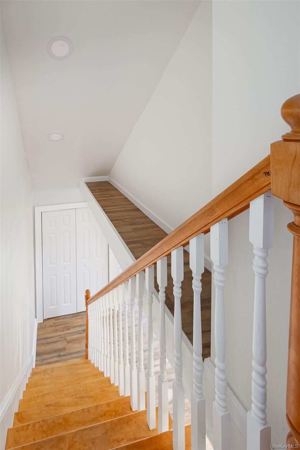 4 Walnut Street Poughkeepsie, NY 12601 - Photo 13 of 26 a view of staircase with railing and white walls