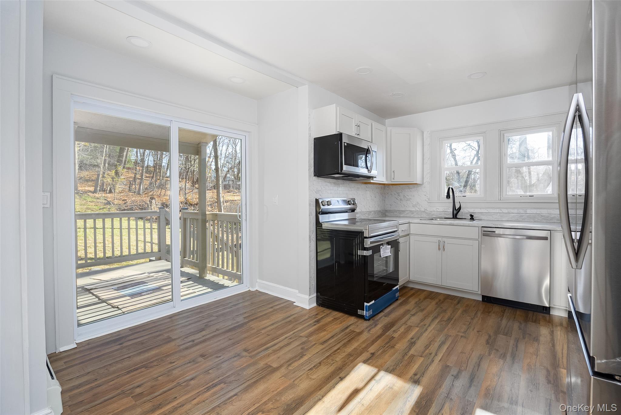 4 Walnut Street Poughkeepsie, NY 12601 - Photo 7 of 26 a kitchen with a refrigerator and a stove top oven