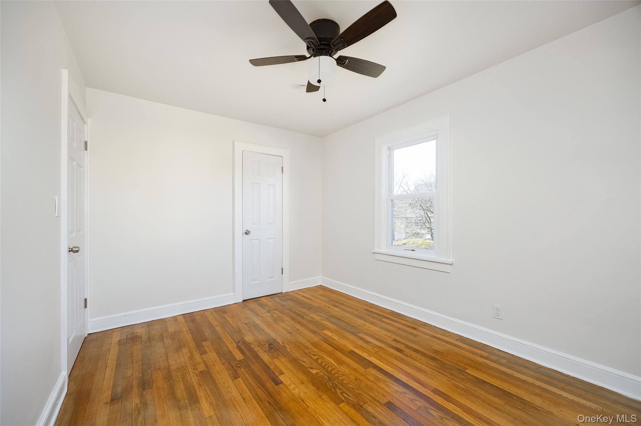4 Walnut Street Poughkeepsie, NY 12601 - Photo 10 of 26 a view of empty room with wooden floor and fan