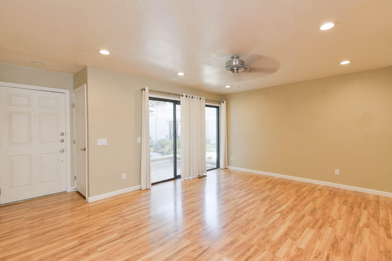 278 South Seneca Circle, Unit 47 Anaheim, CA 92805 - Photo 11 of 29 a view of an empty room with wooden floor and a window