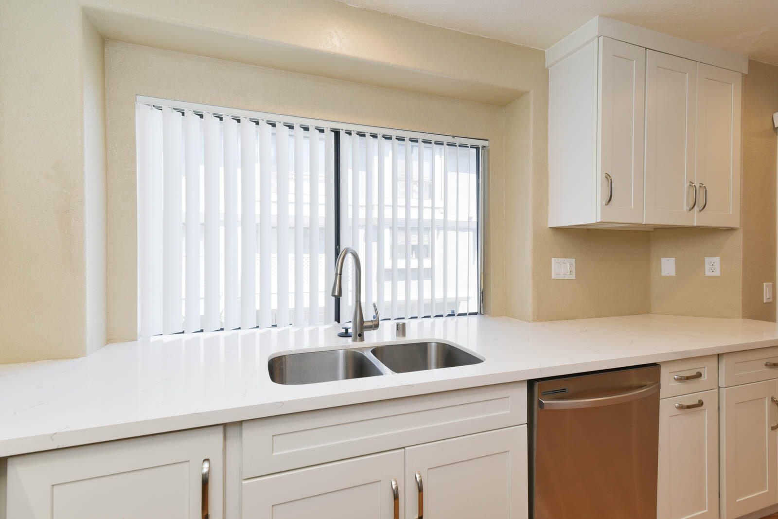 278 South Seneca Circle, Unit 47 Anaheim, CA 92805 - Photo 15 of 29 a kitchen with a sink and cabinets