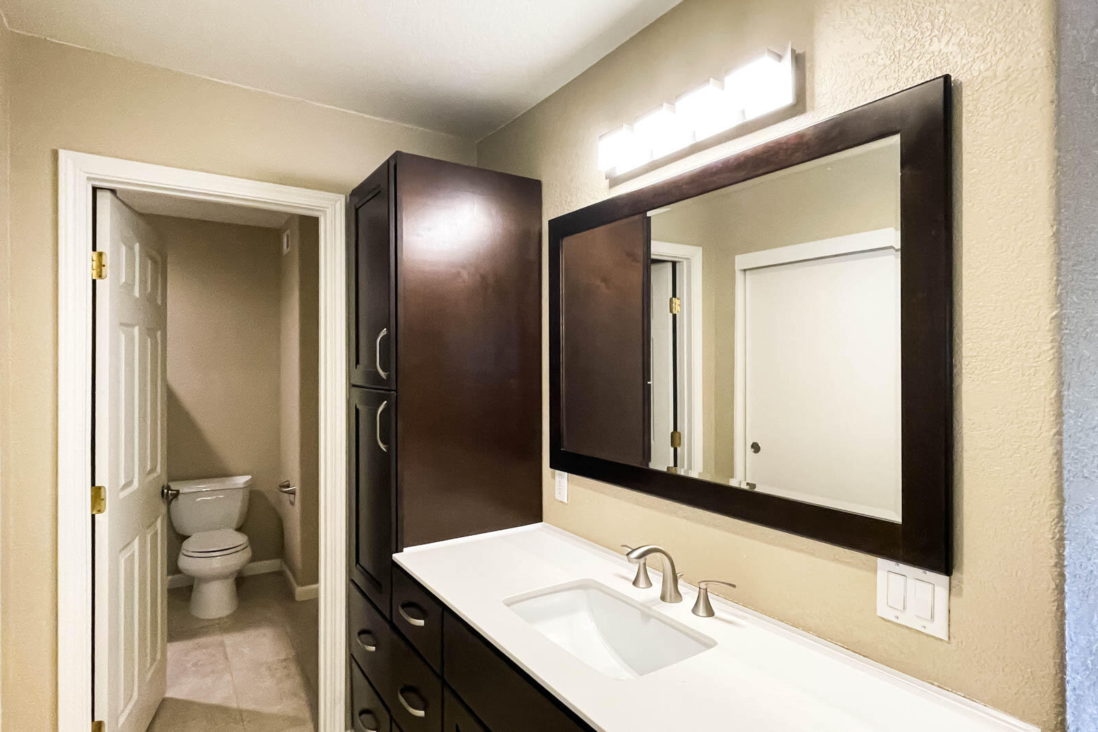 278 South Seneca Circle, Unit 47 Anaheim, CA 92805 - Photo 19 of 29 a bathroom with a sink and a mirror