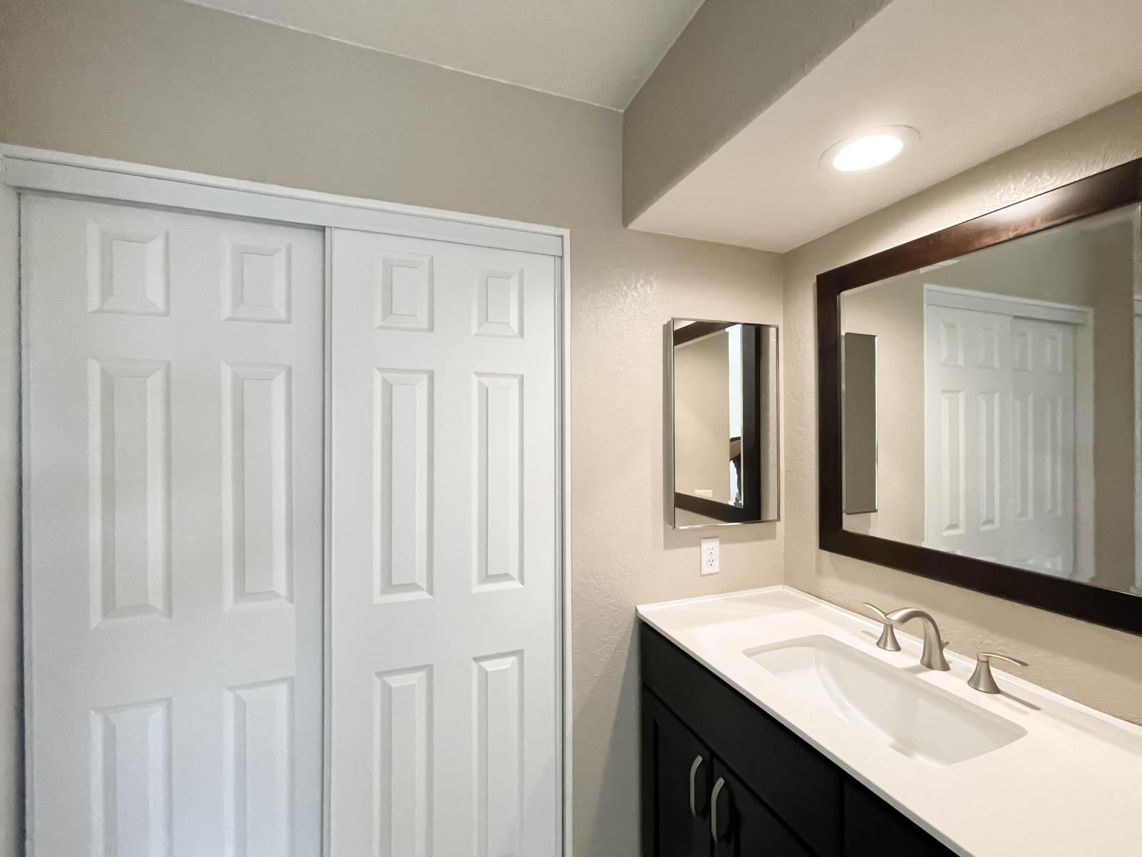 278 South Seneca Circle, Unit 47 Anaheim, CA 92805 - Photo 22 of 29 a bathroom with a double vanity sink and a mirror