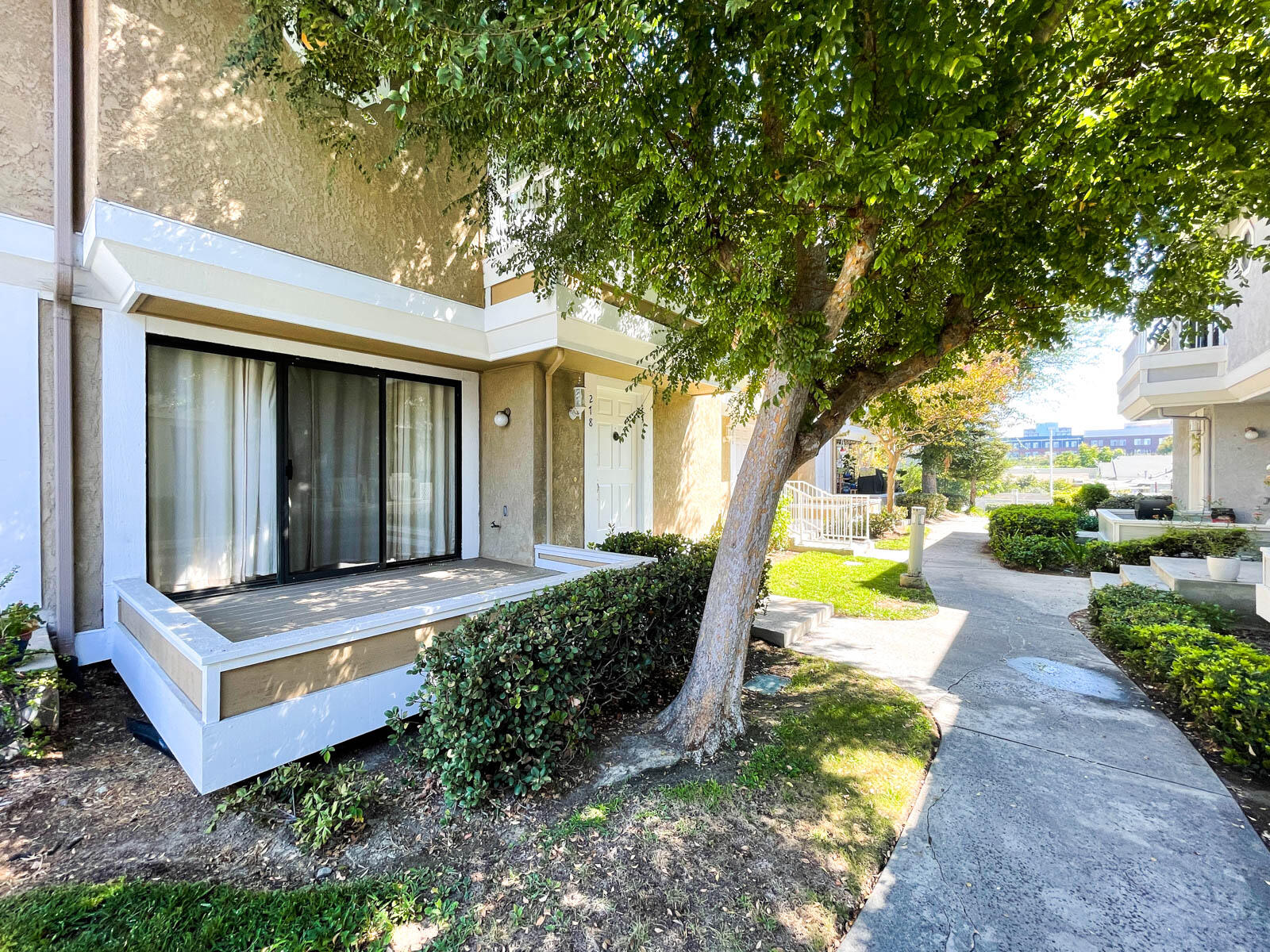 278 South Seneca Circle, Unit 47 Anaheim, CA 92805 - Photo 25 of 29 a view of a house with a yard and large tree