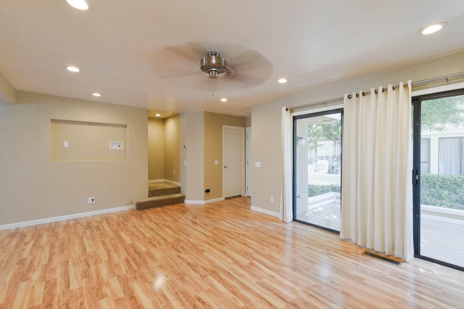 278 South Seneca Circle, Unit 47 Anaheim, CA 92805 - Photo 10 of 29 a view of an empty room with wooden floor and a window