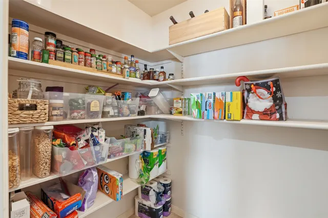 a shelf with wine glasses and glasses