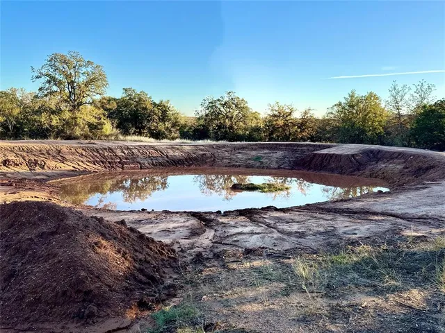 a view of a swimming pool with a yard