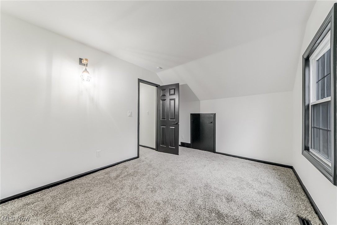 38470 Bainbridge Road Solon, OH 44139 - Photo 11 of 17 Bedroom featuring carpet floors and vaulted ceiling