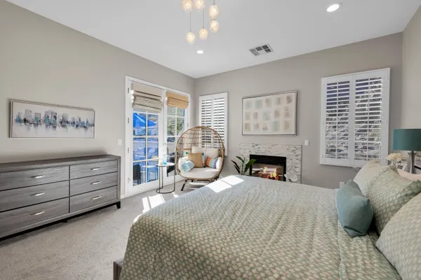 a bed room with furniture and a fireplace
